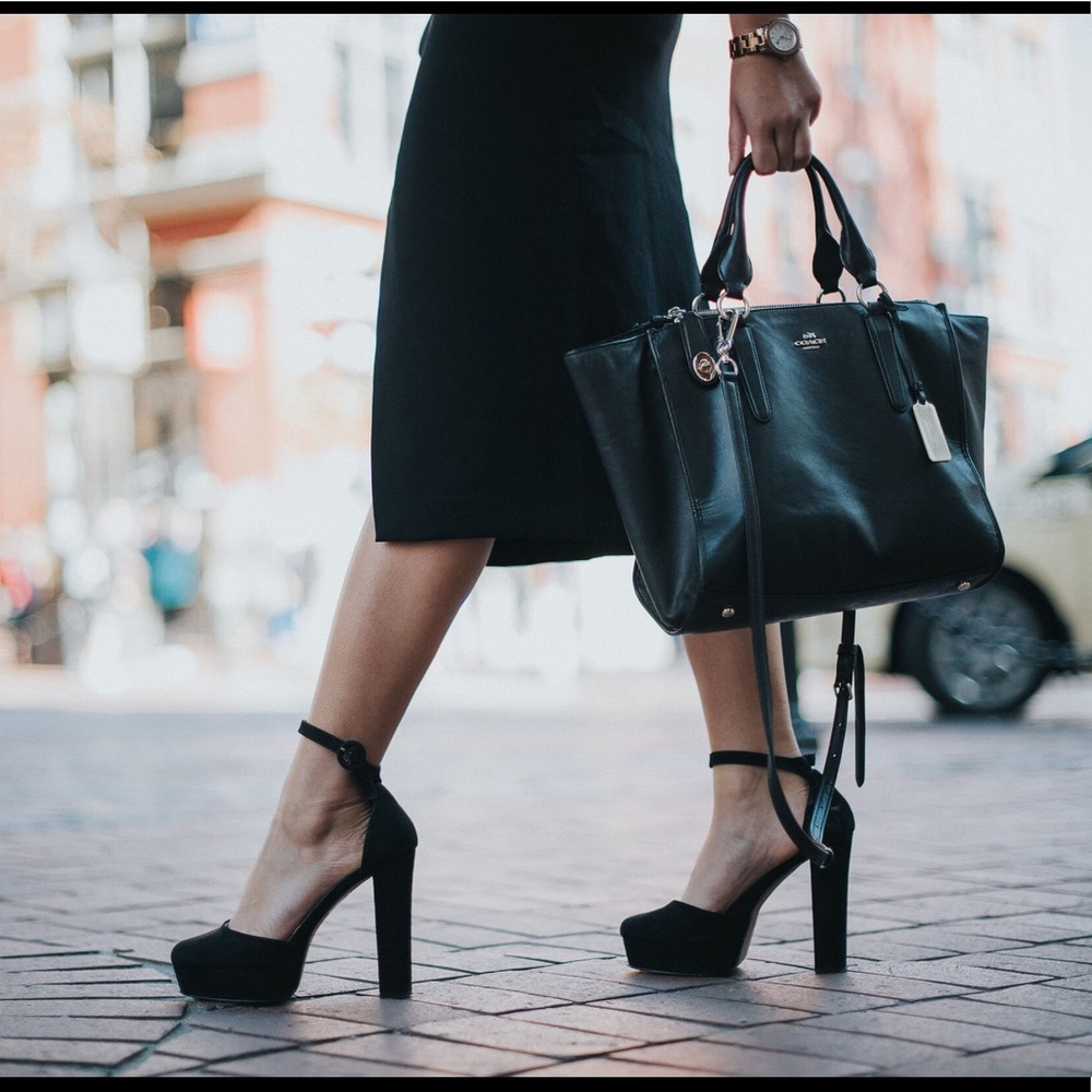 Black coach purse with gold hardware